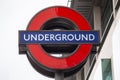 FULHAM, LONDON, ENGLAND- 17 February 2021: UNDERGROUND roundel outside Fulham Broadway tube station Royalty Free Stock Photo