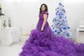 Full Asian woman in a lush lilac dress. Royalty Free Stock Photo