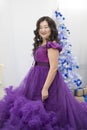 Full Asian woman in a lush lilac dress. Royalty Free Stock Photo