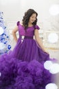 Full Asian woman in a lush lilac dress. Royalty Free Stock Photo