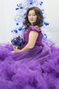 Full Asian woman in a lush lilac dress. Royalty Free Stock Photo