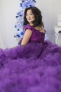 Full Asian woman in a lush lilac dress. Royalty Free Stock Photo