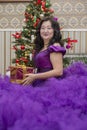 Full Asian woman in a lush lilac dress. Royalty Free Stock Photo