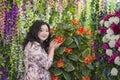 Full Asian woman in the room with flowers. Royalty Free Stock Photo