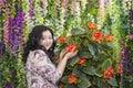 Full Asian woman in the room with flowers. Royalty Free Stock Photo