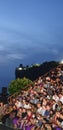 a full audience at the Ramayana ballet performance at the Uluwatu temple in Bali against a blue sky at night Royalty Free Stock Photo