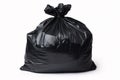 Full black garbage bag in front of white background Royalty Free Stock Photo