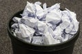 Full black waste paper bin Royalty Free Stock Photo