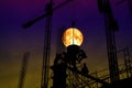 full blood moon back silhouette worker on construction