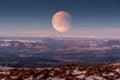 Full moon rising on the Rocky Mountains at Pikes Peak Royalty Free Stock Photo