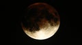 A full, blood red moon, in the night sky, with a dark background Royalty Free Stock Photo