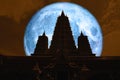 full blue moon back silhouette triple pagoda in night sky