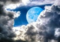 Full Blue Moon Passing Through The Heavenly Clouds