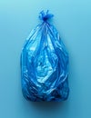 Full blue plastic garbage bag isolated on blue background Royalty Free Stock Photo