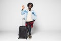 Full body of African american business man traveling with suitcases showing an ok sign with fingers. Face of happiness and Royalty Free Stock Photo