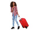 Full body beautiful young african american woman walking with suitcase and phone on white background Royalty Free Stock Photo