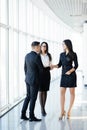 Full body Businessman And Businesswoman Shaking Hands In Office hall at informal meeting Royalty Free Stock Photo