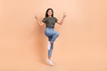 Full body cadre of carefree chinese girl funky show double v-sign hello greetings advert outlet clothes isolated on