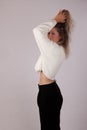 Blond casual woman profile white sweater background