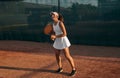 Tennis player with racket on court Royalty Free Stock Photo