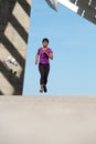 Full body healthy young african american woman running outdoors Royalty Free Stock Photo