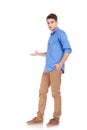 Full body image of a young casul man presenting Royalty Free Stock Photo