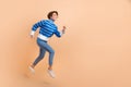 Full body length photo of active running hurry woman fast speed motivation career empty space blue striped sweater
