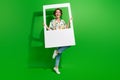 Full body length photo of attractive funky young lady hold paper frame cadre window happiness concept isolated on green