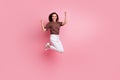 Full body length photo of energetic lady jumping raised fists up celebrating her awesome productivity isolated on pink Royalty Free Stock Photo