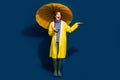 Full body length photo of funky woman red beanie hat palm trying catch drops raining weather hold parasol isolated on