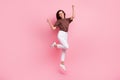 Full body length photo of young successful lady brunette hair business woman jumping celebration moment isolated on pink Royalty Free Stock Photo