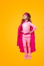 Confident superhero kid in pink outfit Royalty Free Stock Photo