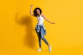 Full body photo of afro american woman dance wear tight waist jacket sunglass  on funky yellow color background Royalty Free Stock Photo