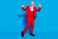 Full body photo of aged rich man happy positive smile have fun dance party isolated over blue color background Royalty Free Stock Photo