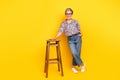 Full body photo of attractive pensioner woman stand lean on chair dressed stylish leopard print clothes isolated on Royalty Free Stock Photo