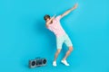 Full body photo of attractive young man tape recorder cool dancer modern dance wear trendy pink garment isolated on cyan Royalty Free Stock Photo