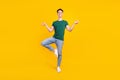 Full body photo of charming positive calm man asana yoga good mood isolated on yellow color background