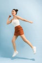 Full body photo of cheerful excited energetic girl jump enjoy spring free time holiday weekend over bright color