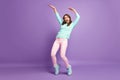 Full body photo of chilling funny lady raise hands dancing youth modern moves crazy student wear casual fluffy pullover