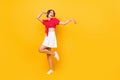 Full body photo of crazy excited person look empty space have good mood on yellow color background