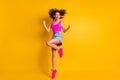 Full body photo of crazy funny pretty youngster lady jump high listen earphones modern technology rejoice best song wear