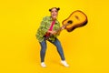 Full body photo of crazy happy afro american woman play guitar funky mood isolated on yellow color background Royalty Free Stock Photo