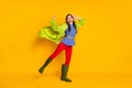 Full body photo of enthusiastic girl enjoy rejoice spring season rainy walk wear good look gum shoes coat isolated over