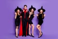 Full body photo of four group people wizard guy and witch girlfriends playing evil roles biting scratching wear dresses