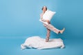 Full body photo of funky funny brown bob haired girl dance stank blanket hold pillow on blue color background