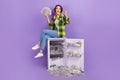 Full body photo of funky young overjoyed woman winnings millions dollars much money fridge banknotes isolated on violet Royalty Free Stock Photo