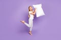 Full body photo of funny funky crazy emotions blonde hair girl barefoot hold pillow want play game sleep-over party with Royalty Free Stock Photo