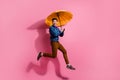 Full body photo of hurry up running gentlemen enjoying retro glamour outfit holding bright umbrella isolated on pink