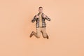 Full body photo of mature man show thumbs-up like choice recommend advise fly isolated over beige color background