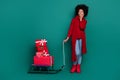 Full body photo of nice pupil girl scarf pull sleigh new year gifts dressed stylish red knitwear outfit isolated on